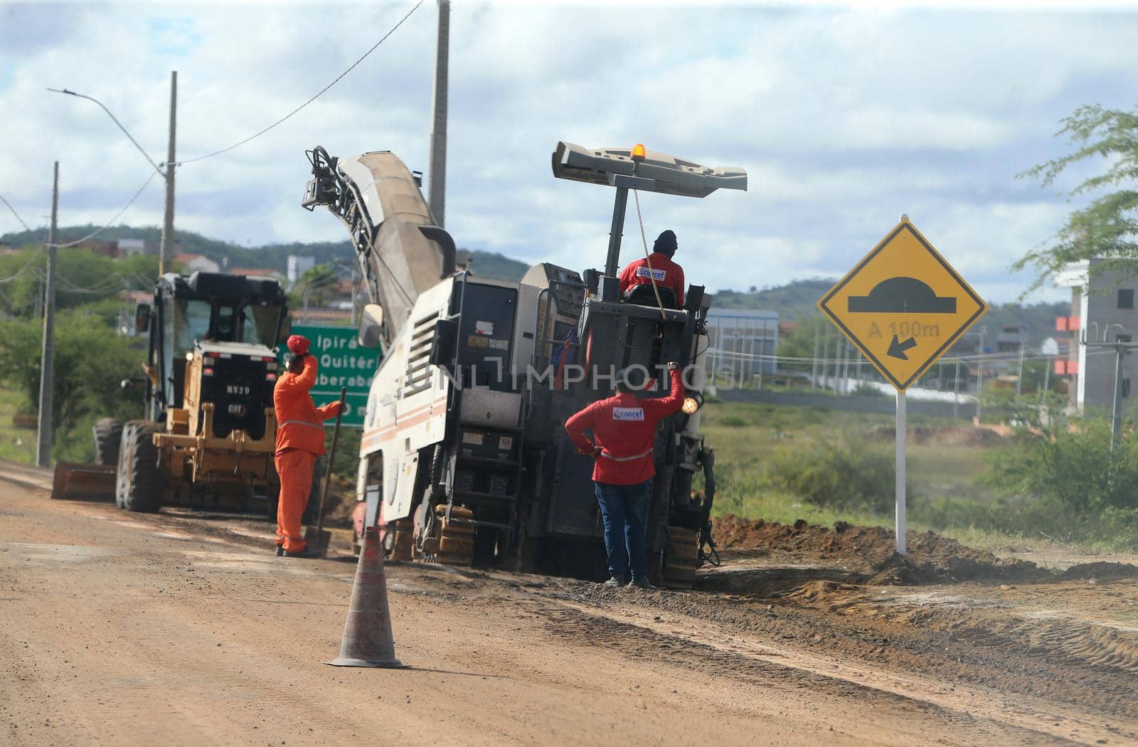 serra preta, bahia, brazil - september 13, 2022: workers recovering the BA 052 highway lane in the city of Serra Preta.