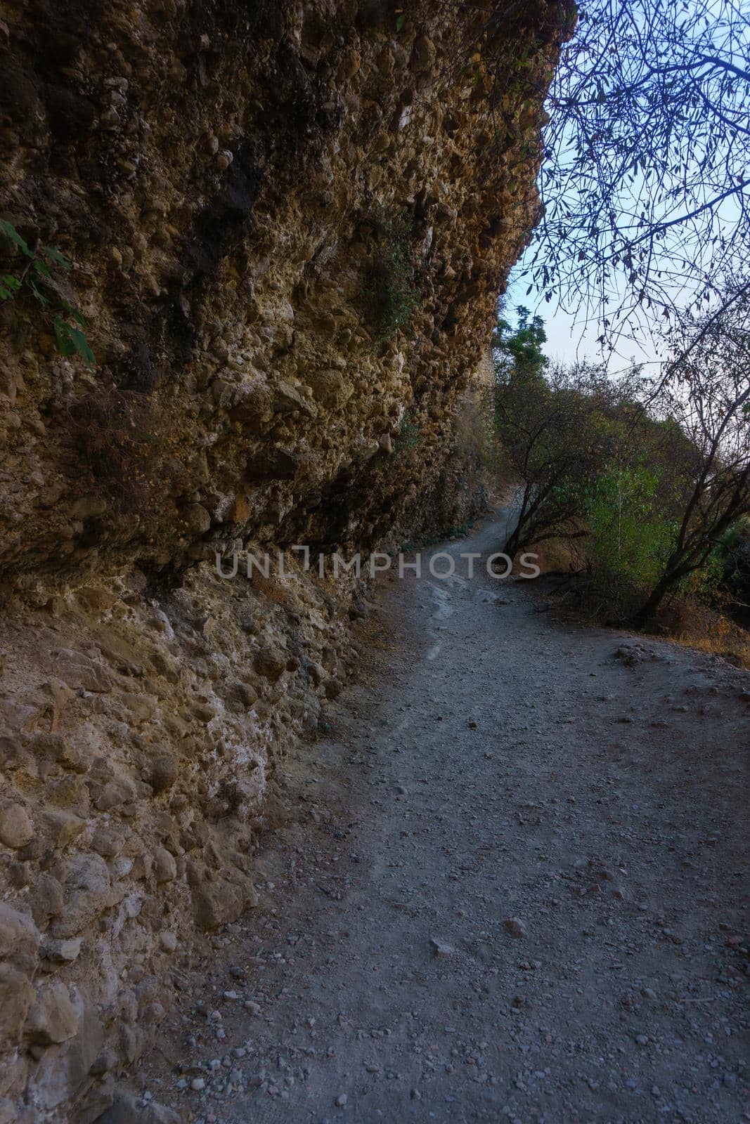 narrow path leading to the base of the new bridge of ronda by joseantona