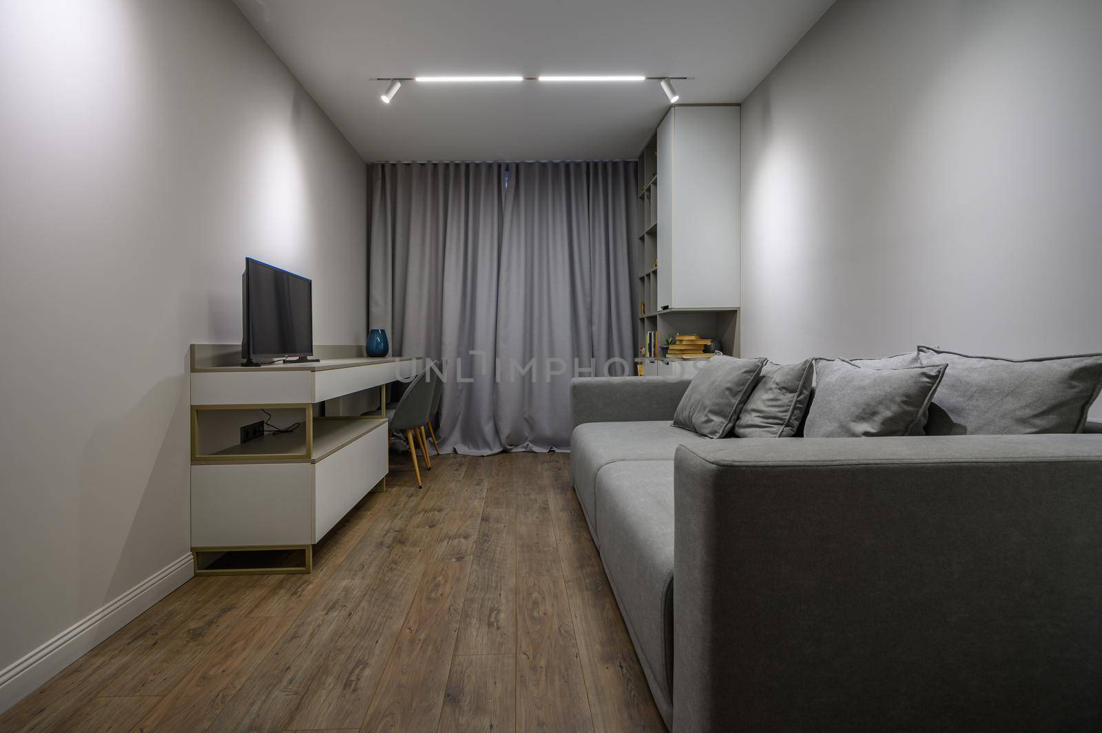 Cozy and luxury bedroom in shades of grey with elegant and modern details