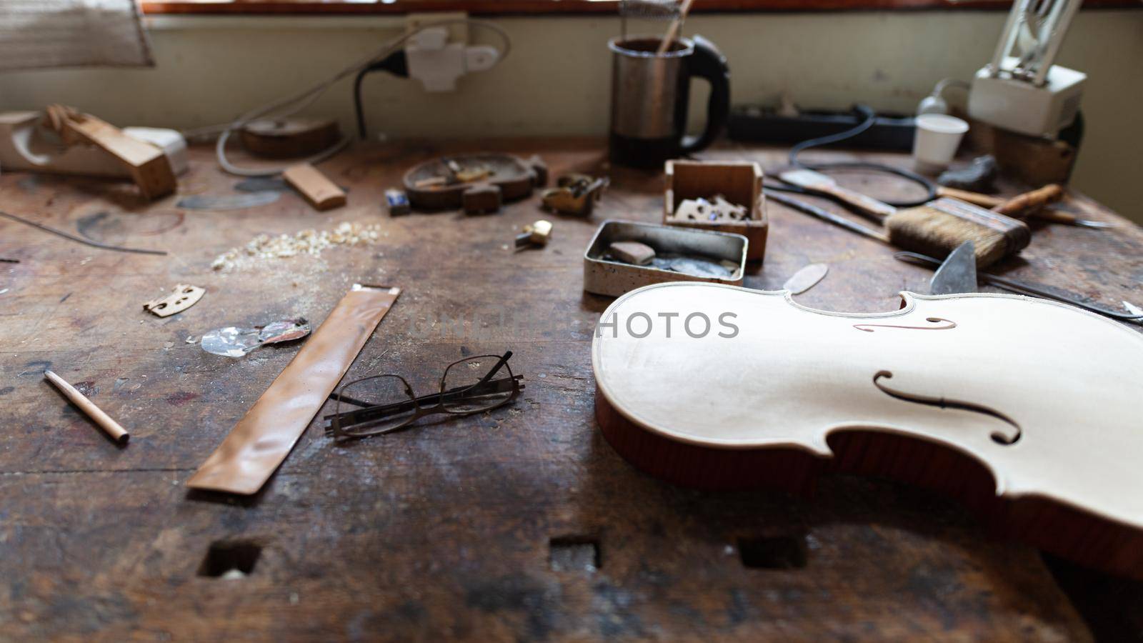 violinmaker at work in his italian workshop