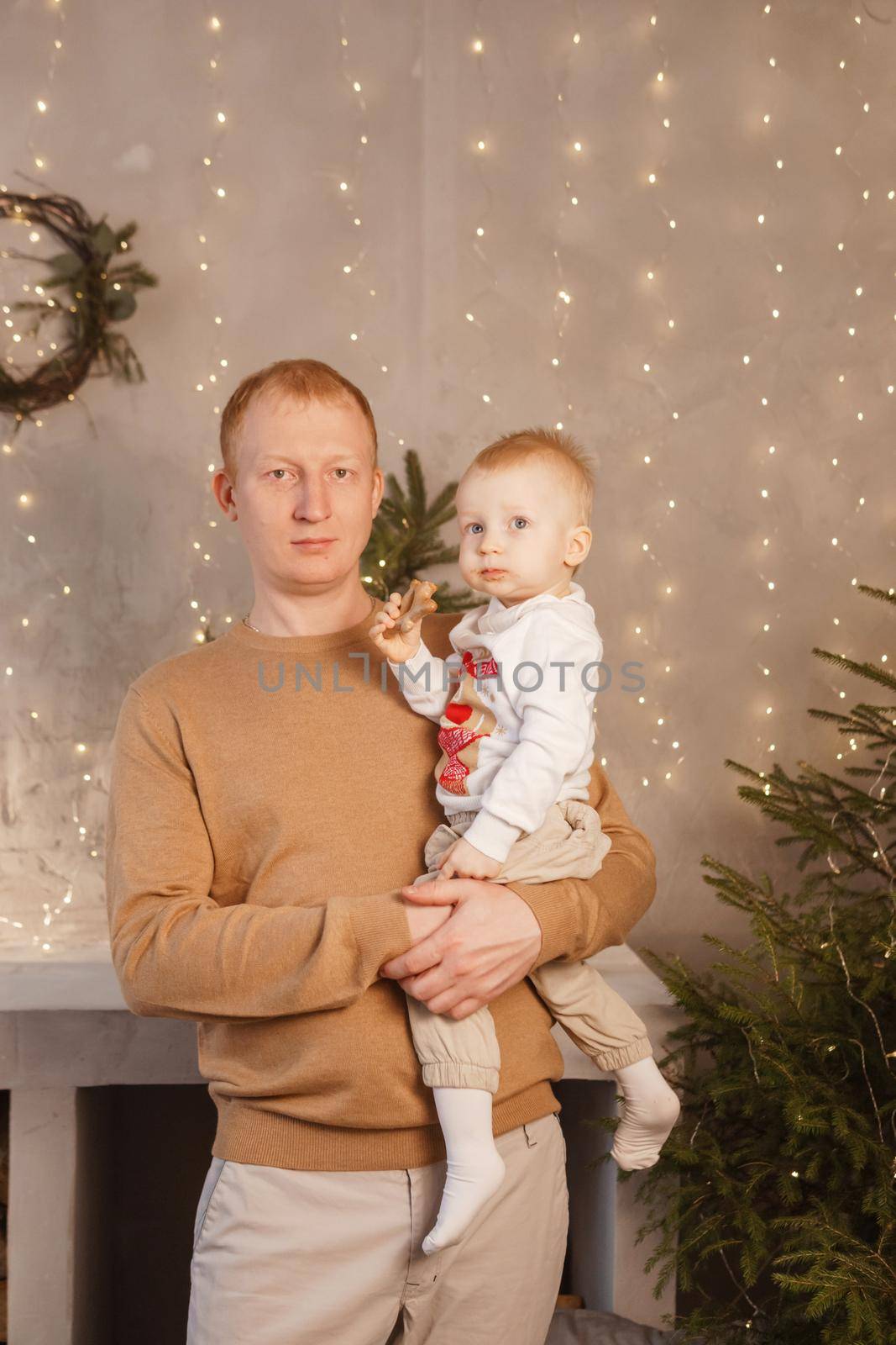 Dad and his little son in a magical Christmas atmosphere. The concept of family relations and New Year celebrations. by Annu1tochka