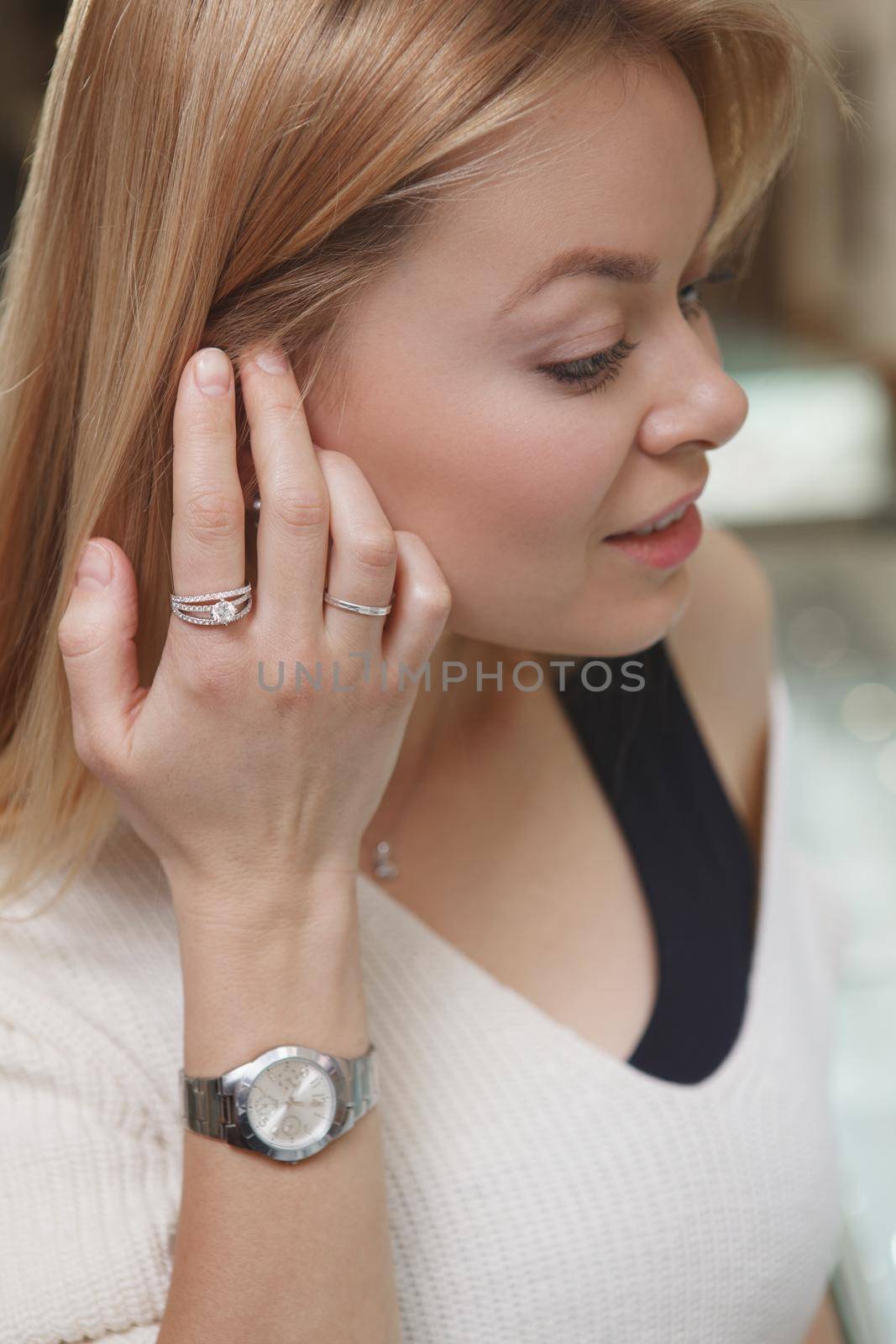 Beautiful woman shopping for jewelry by MAD_Production