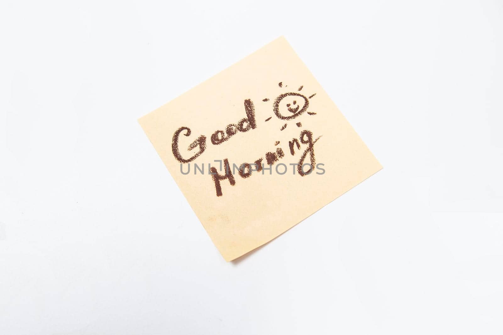 Handwritten note on a yellow sticky paper by MAD_Production