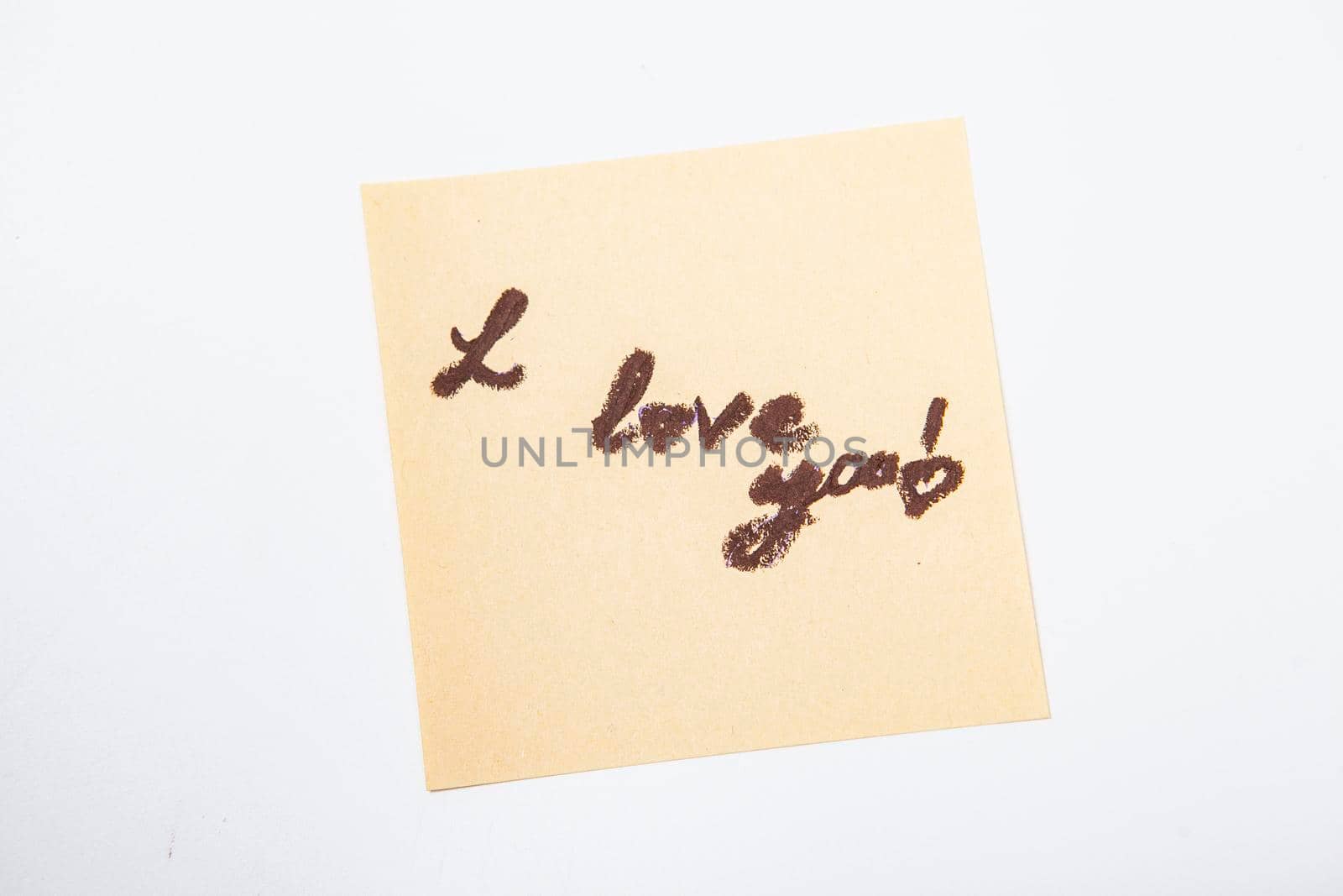 Handwritten note on a yellow sticky paper by MAD_Production