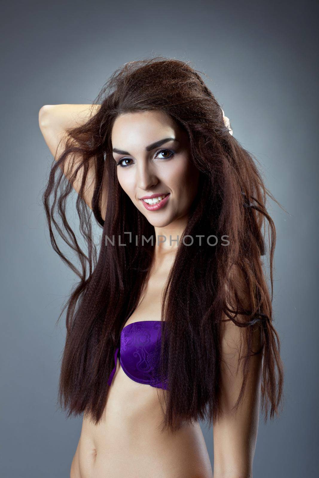 Sexy woman in purple bra portrait with hair style