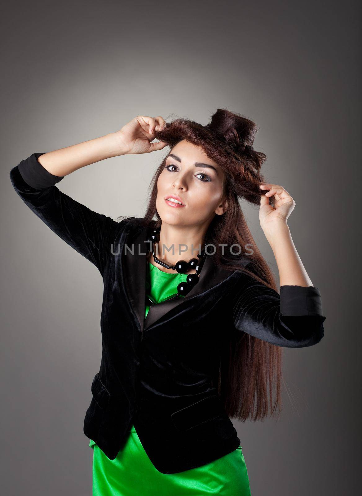 Beauty brunette woman portrait with hair style hat in green suit and black jacket