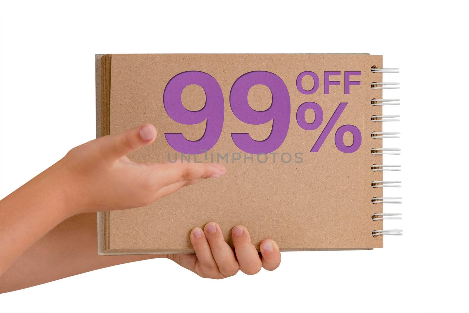 99 percent discount on isolate. Notepad from recycled paper in the hands of a child with text, sale up to 99 percent. The child is holding a notepad demonstrating a big sale