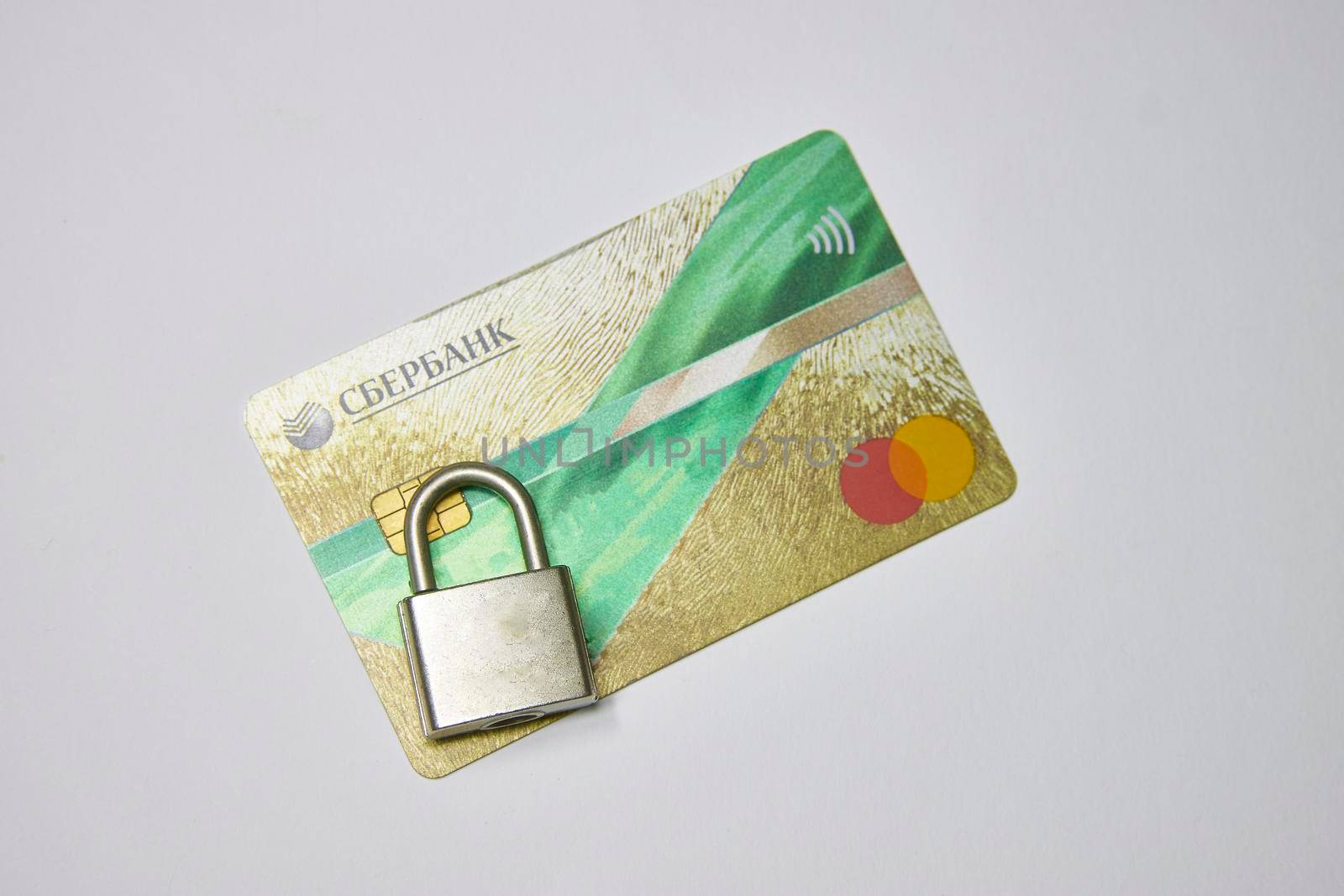 Russia, Syzran - FEBRUARY 27, 2022: sanctions against Sberbank. bank card under lock and key by vadiar