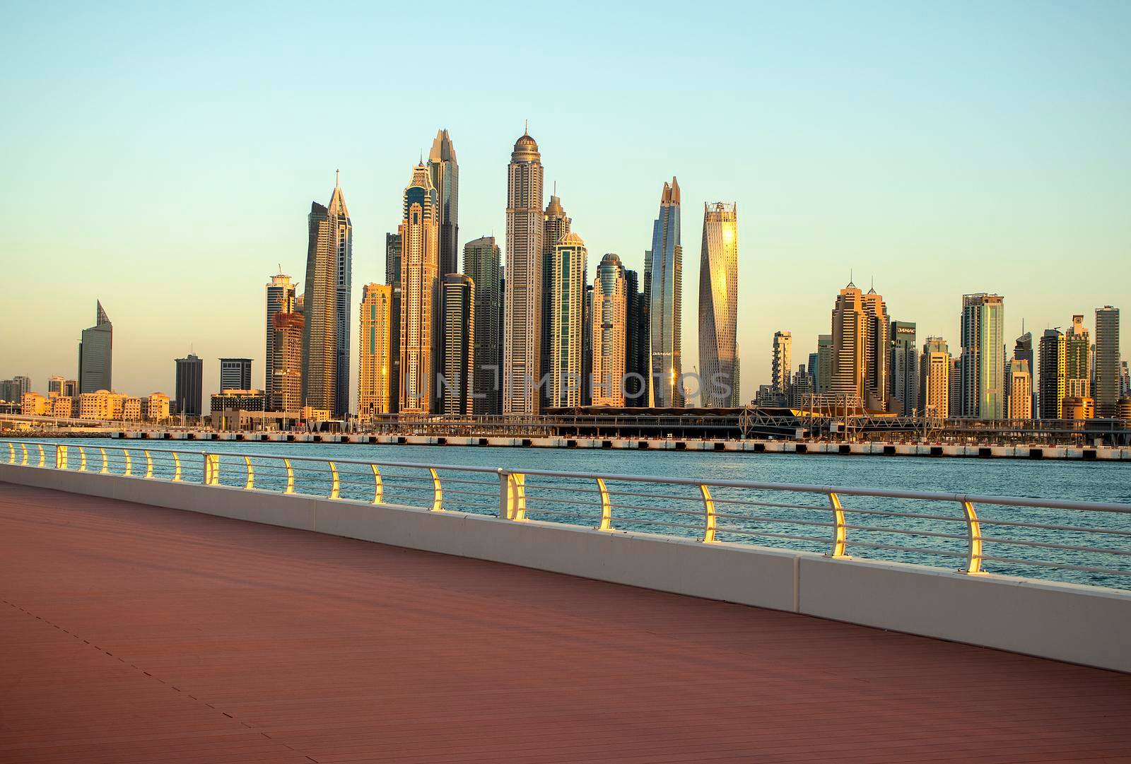 View of A Dubai Marina during sunset hour. Shot made from Palm Jumeirah, man made island. Dubai, UAE. Outdoors.