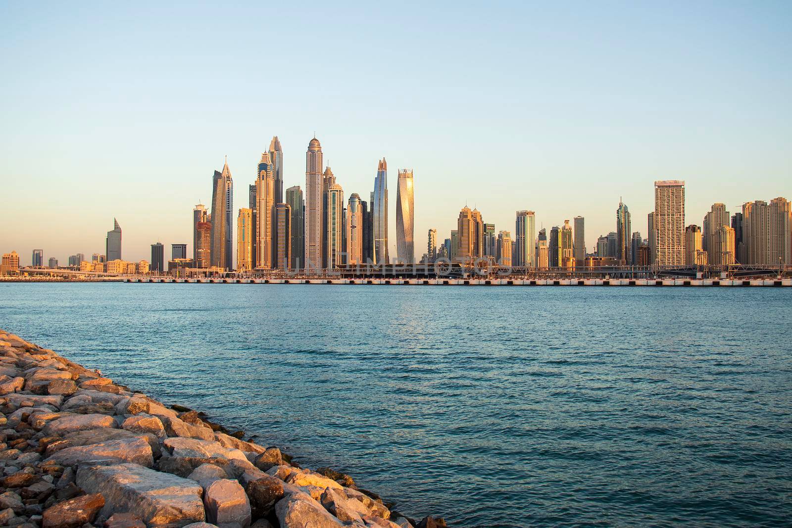 View of A Dubai Marina during sunset hour. Shot made from Palm Jumeirah, man made island. Dubai, UAE. Outdoors.