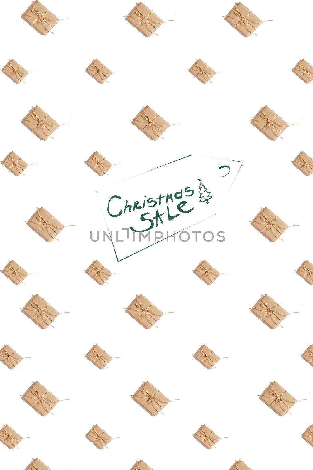 Craft paper present boxes tied from rope on white background, top view. Pattern. Inscription - Christmas SALE. Still life. Flat lay