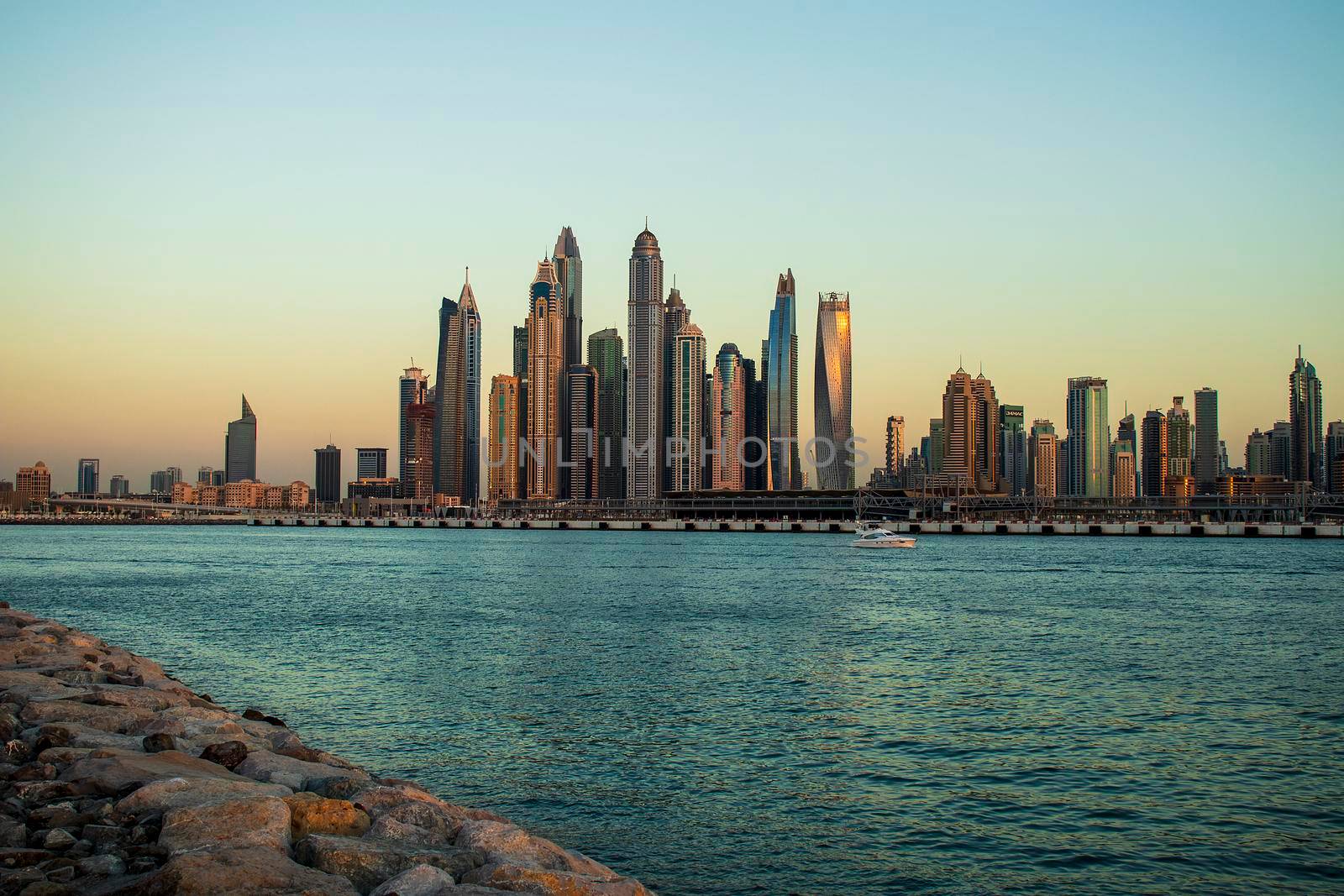 View of A Dubai Marina during sunset hour. Shot made from Palm Jumeirah, man made island. Dubai, UAE. Outdoors.