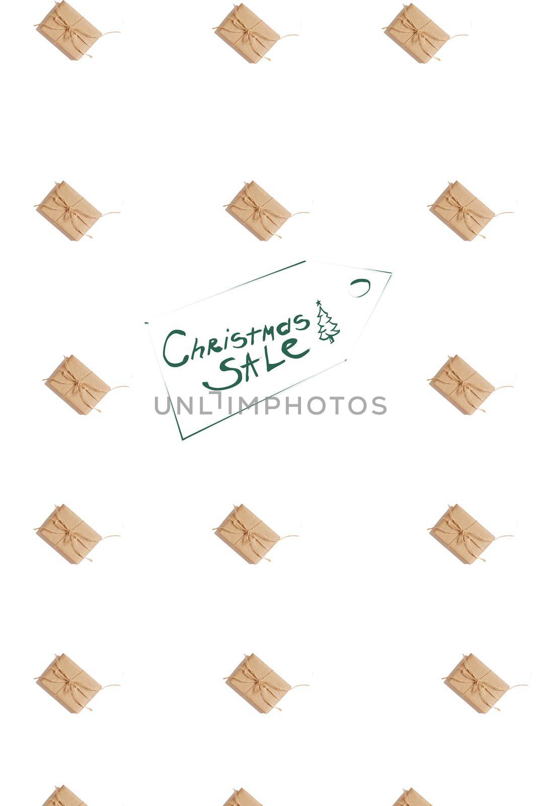 Craft paper present boxes tied from rope on white background, top view. Pattern. Inscription - Christmas SALE. Still life. Flat lay