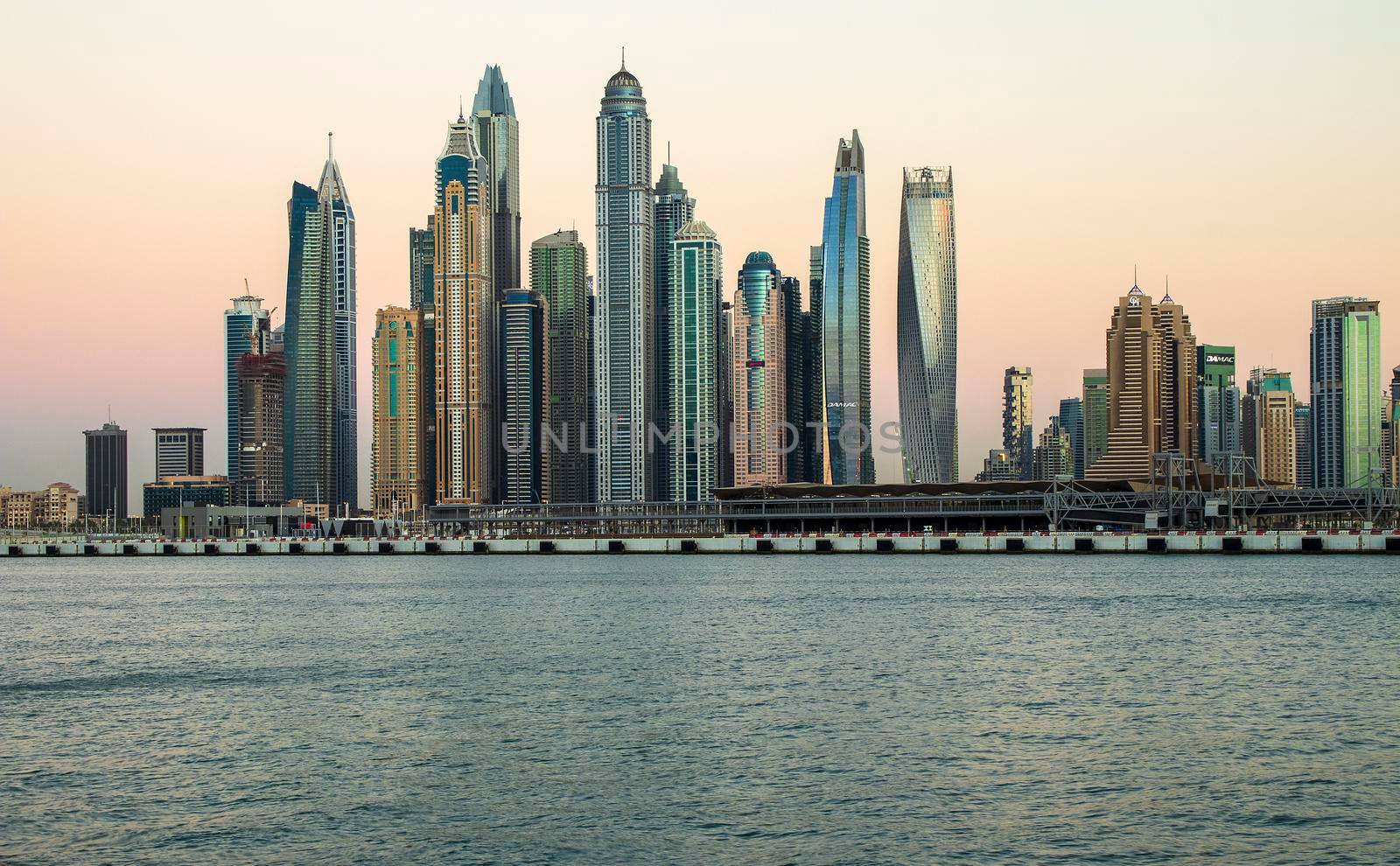 View of A Dubai Marina during sunset hour. Shot made from Palm Jumeirah, man made island. Dubai, UAE. Outdoors.