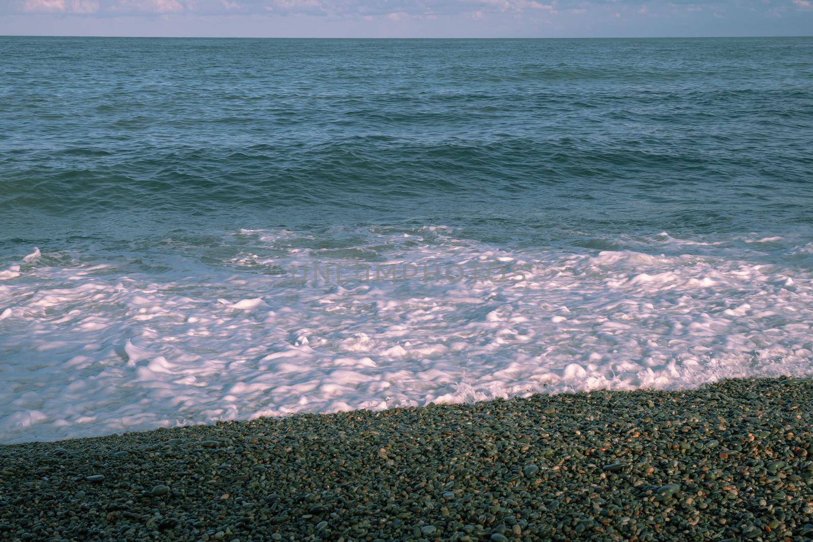 Small seaside waves near the coastline of the Black Sea.