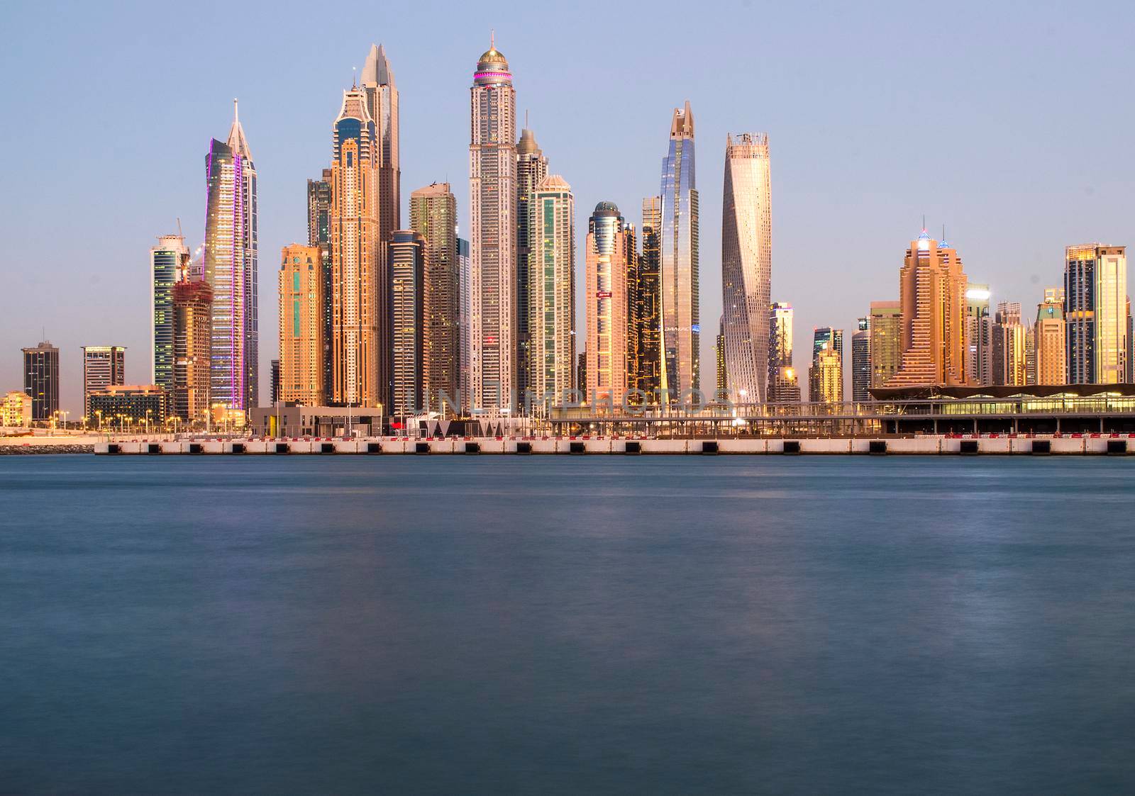 View of A Dubai Marina after sunset. Shot made from Palm Jumeirah, man made island. Dubai, UAE. Outdoors.