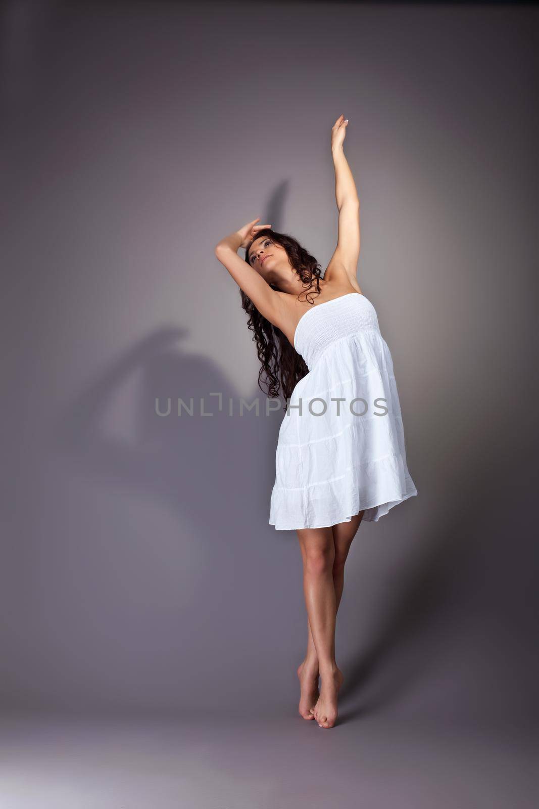 Perfect beauty young woman dance in white cloth