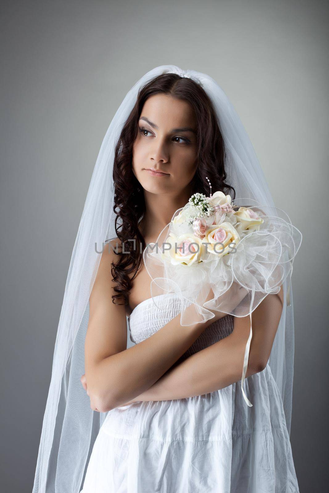 Beauty young woman like bride portrait with bunch of flowers