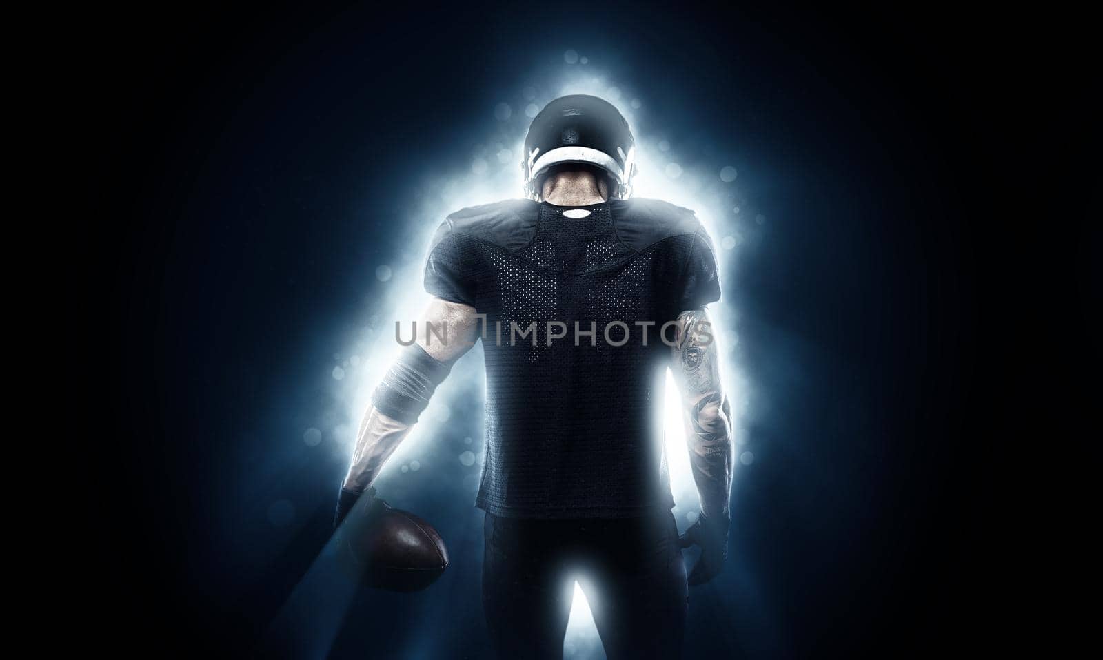 American Football player isolated on black background