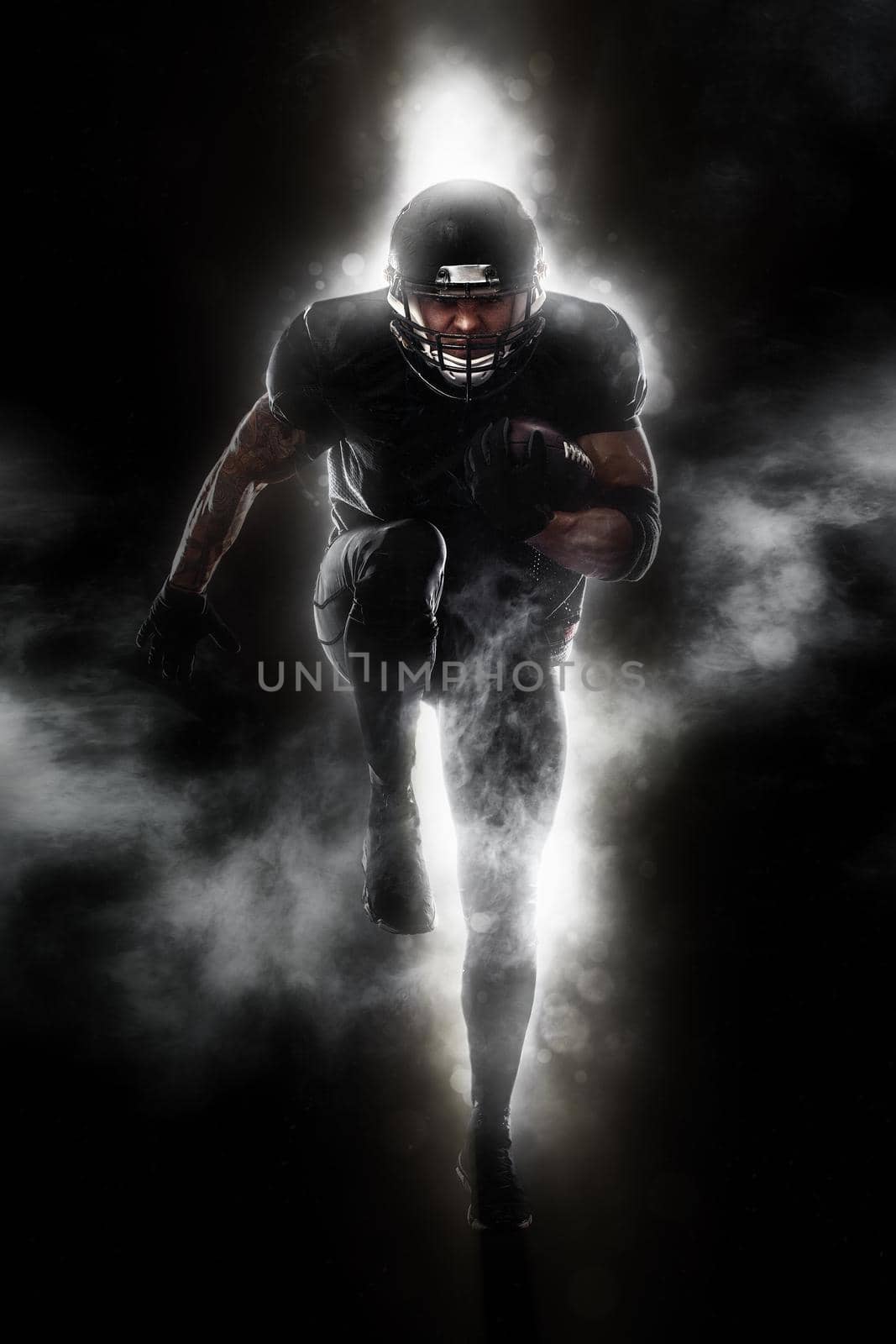 American Football player isolated on black background