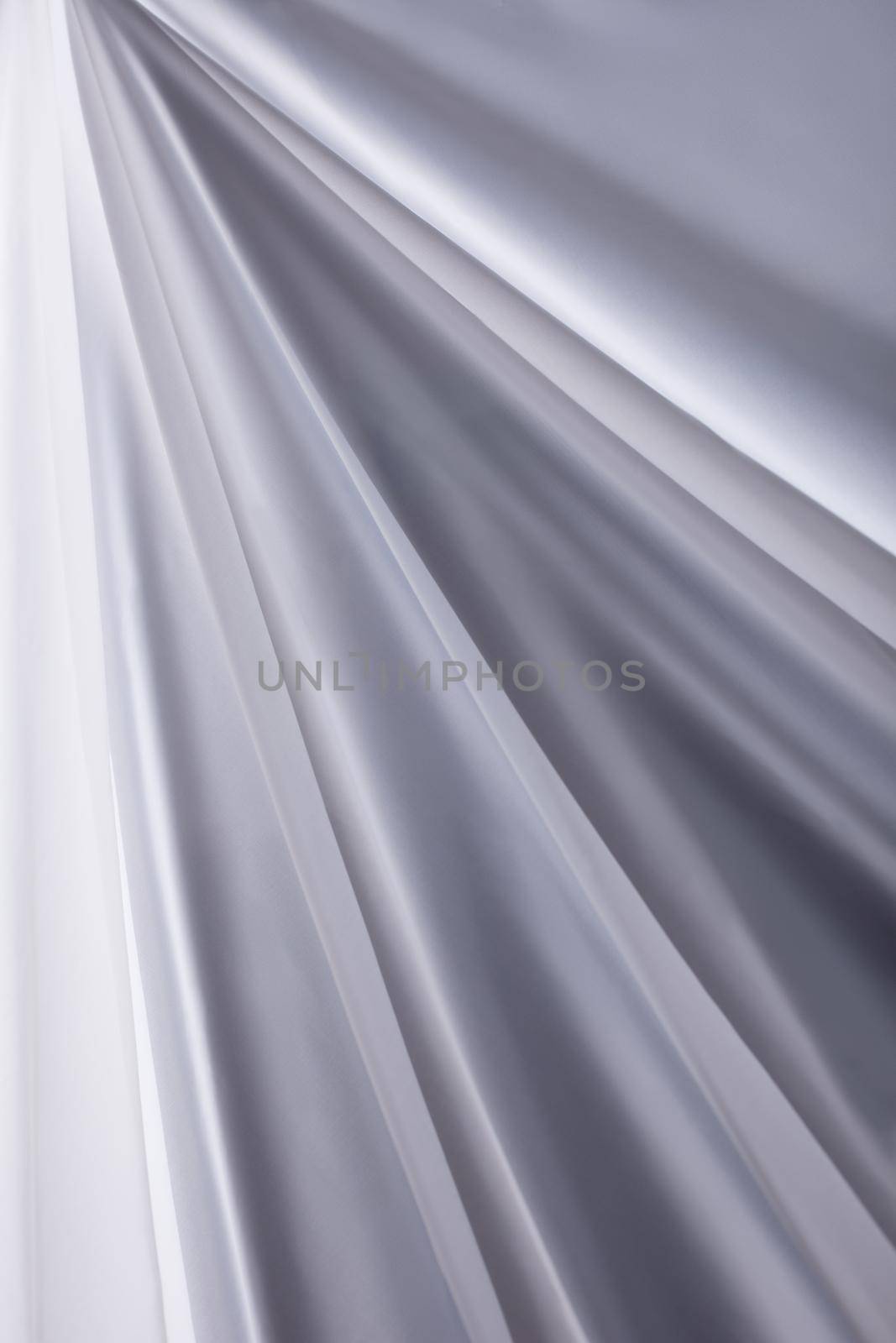 white transparent silk cloth waves background texture close-up