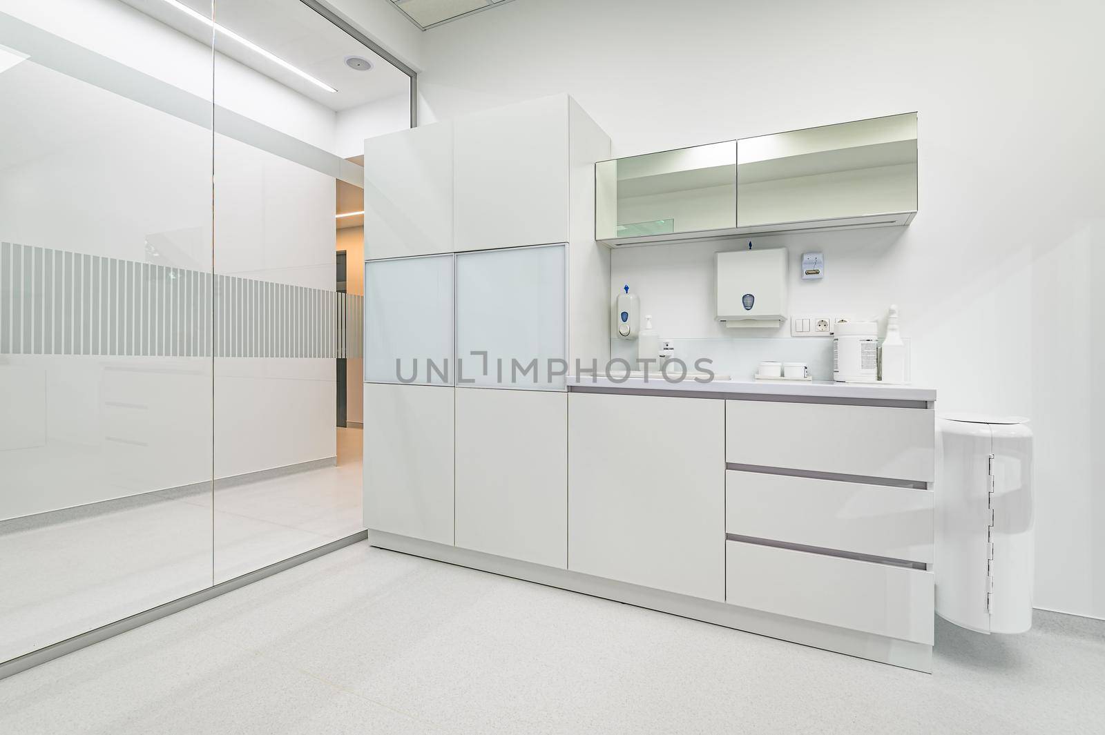 White furniture in modern dentistry medical room with special equipment