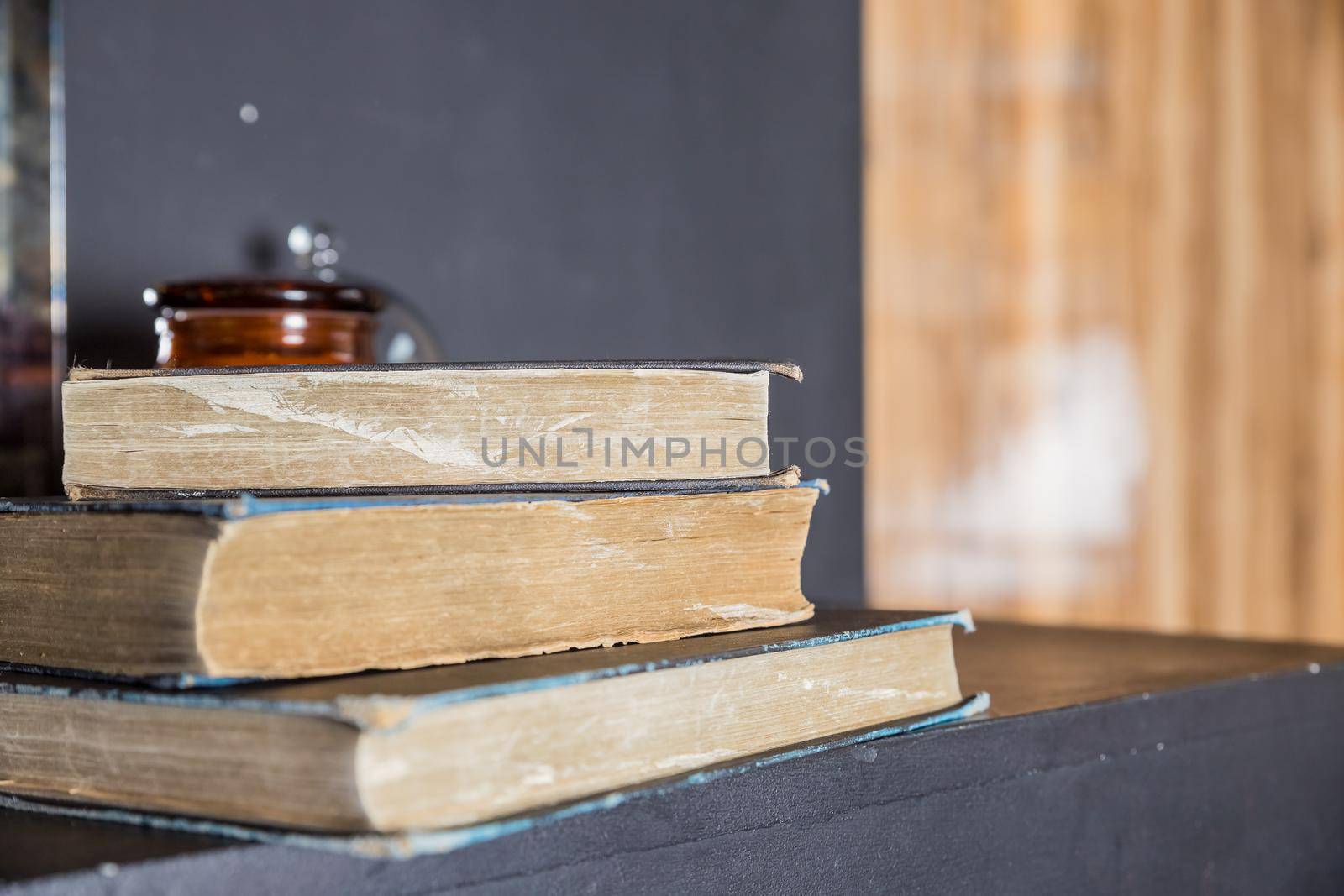 Heap of books with brown background