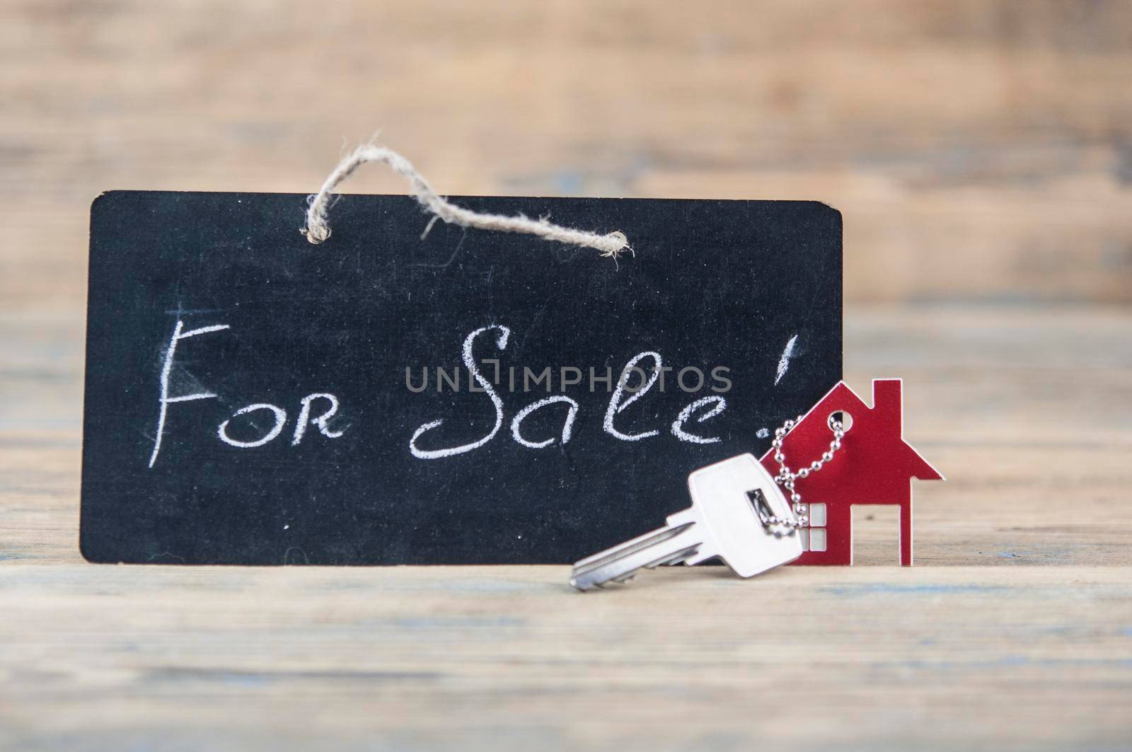 Real Estate Concept. House for sale. Real old blackboard write for sale with miniature house by inxti