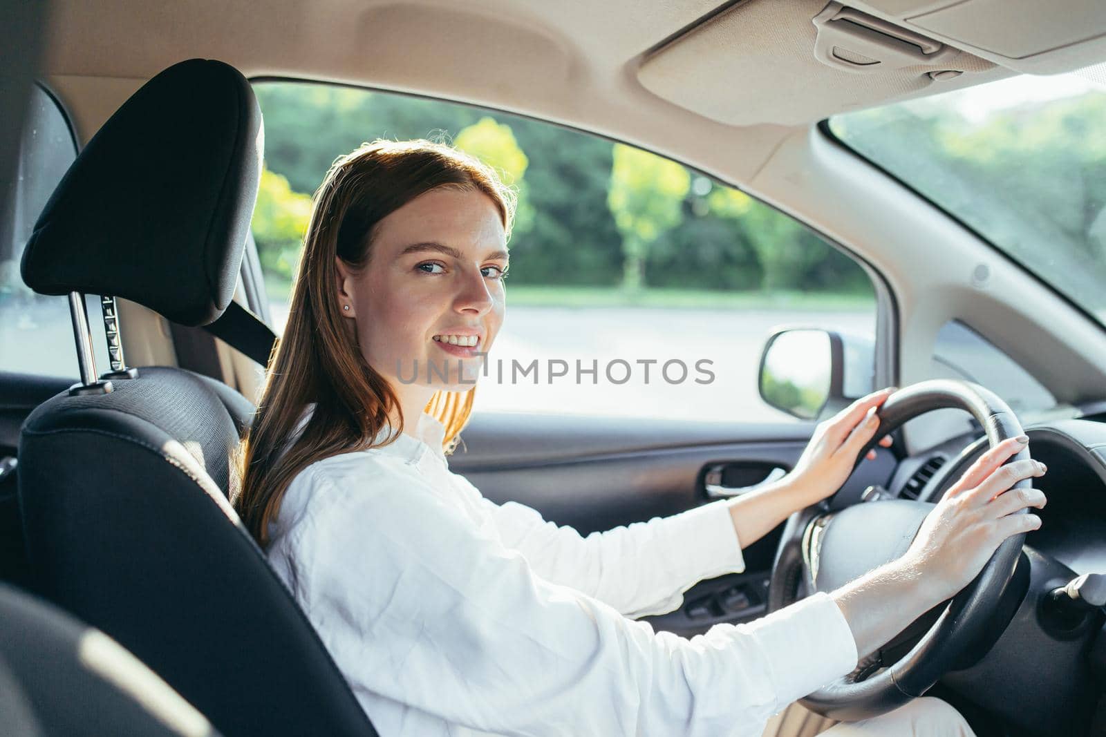 Portrait of happy and successful car driver woman, watercolor pinned with seat belt smiling and looking at camera