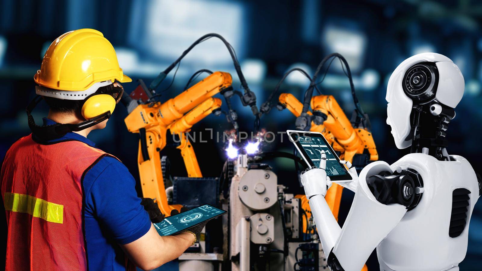 Cybernated industry robot and human worker working together in future factory by biancoblue