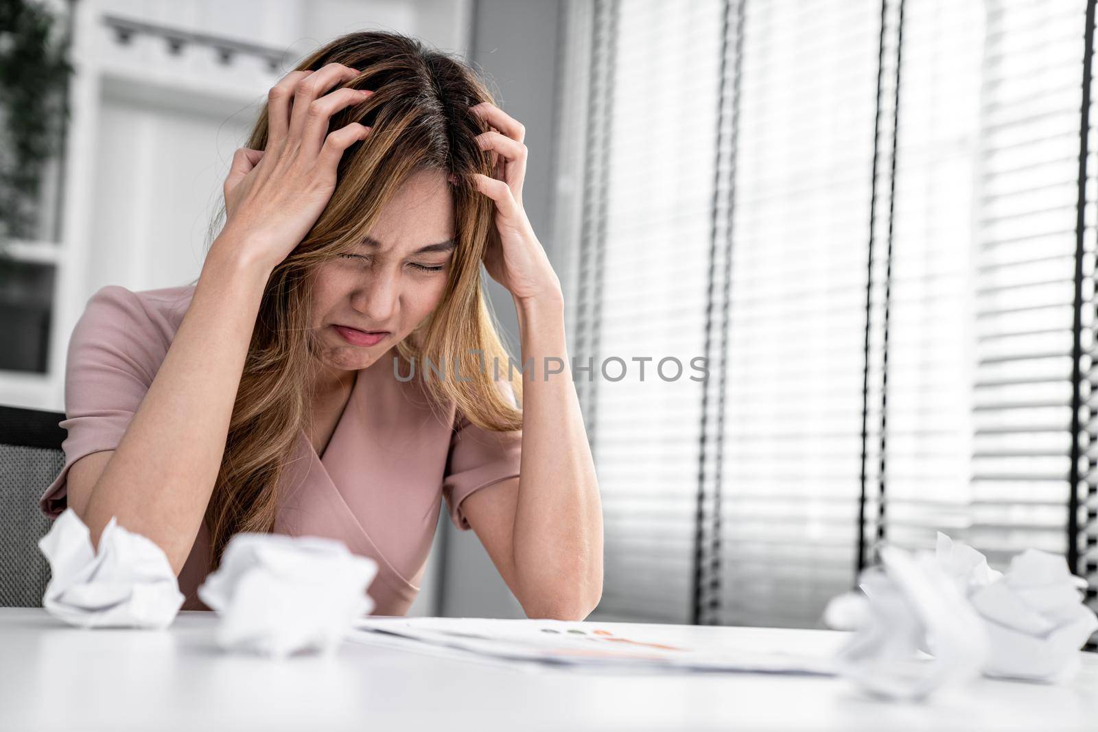 A competent female employee who has become completely exhausted as a result of overburdened work. Concept of unhealthy life as an office worker, office syndrome.