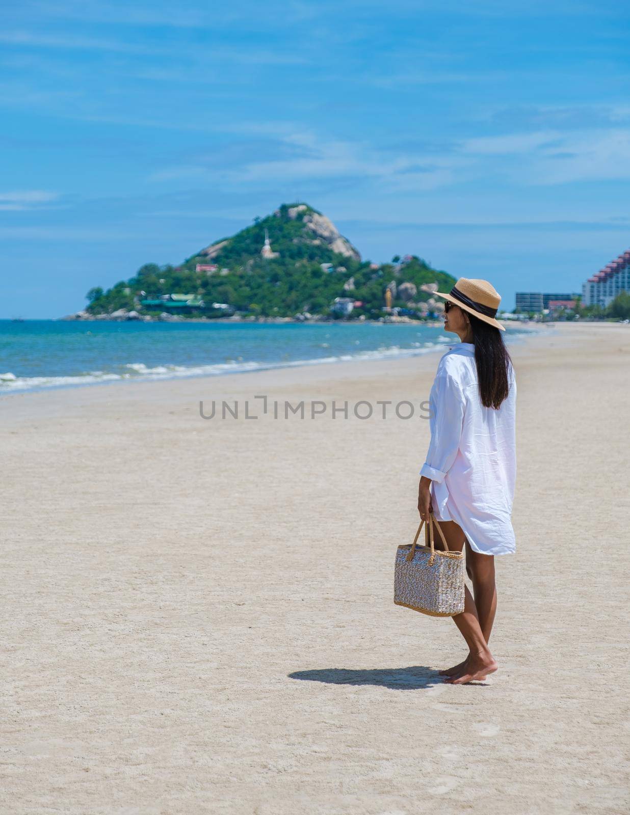 Asian women walking on the beach in the morning at Takiab Beach Huahin Thailand