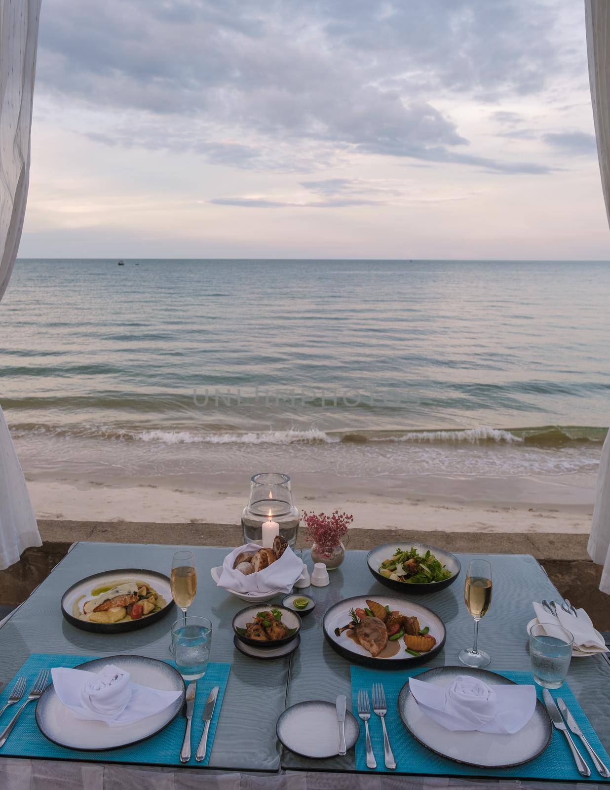 Dinner by candle light on the beach in Thailand by fokkebok