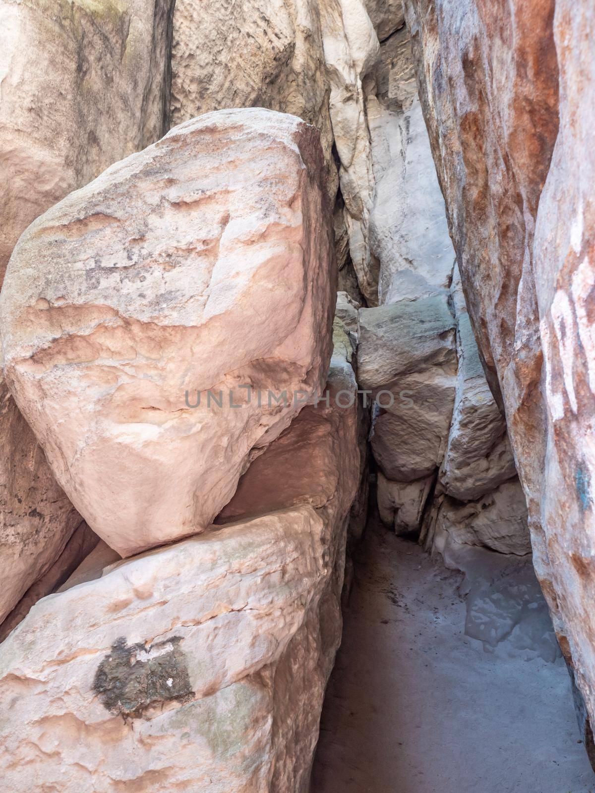 Narrow passage between big rocks in stone labyrinth Ostas rocks by rdonar2
