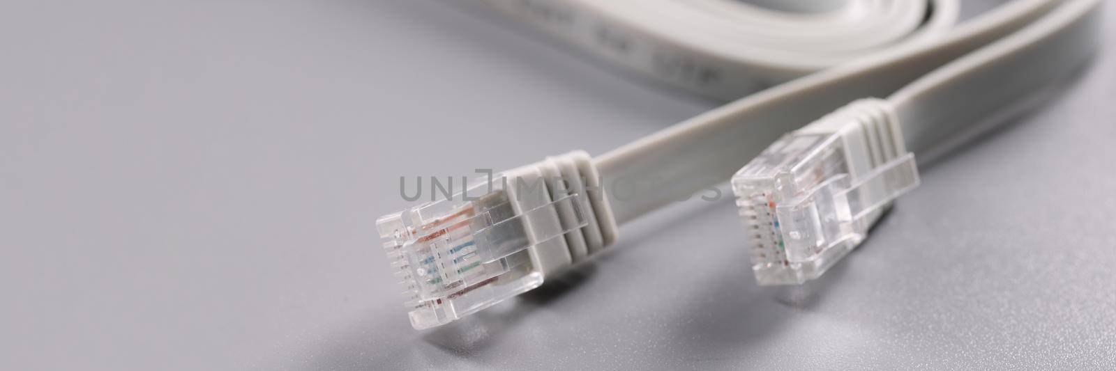 Closeup of rj45 cable on gray background by kuprevich