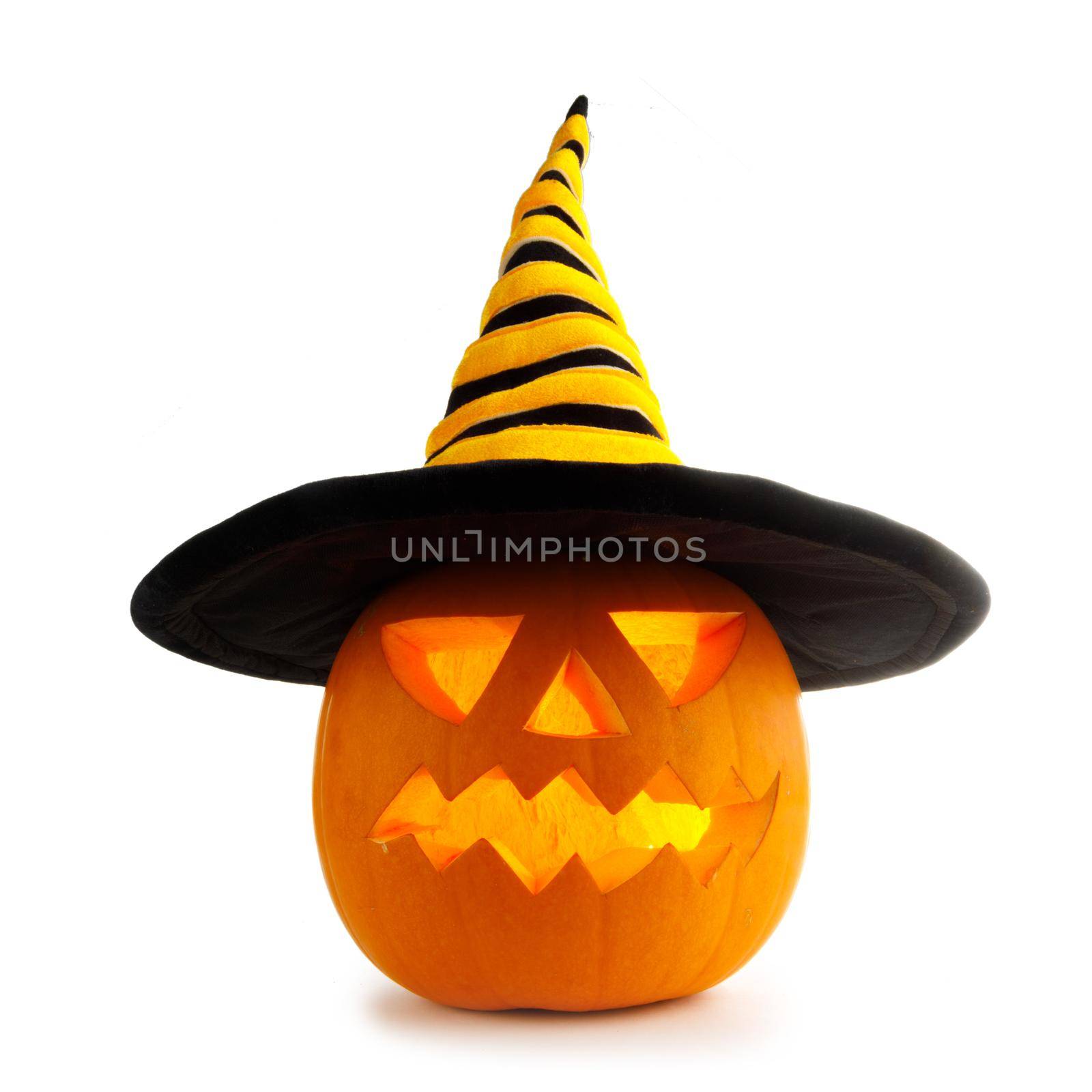 Funny Jack O Lantern Halloween pumpkin wearing witches hat isolated on white background