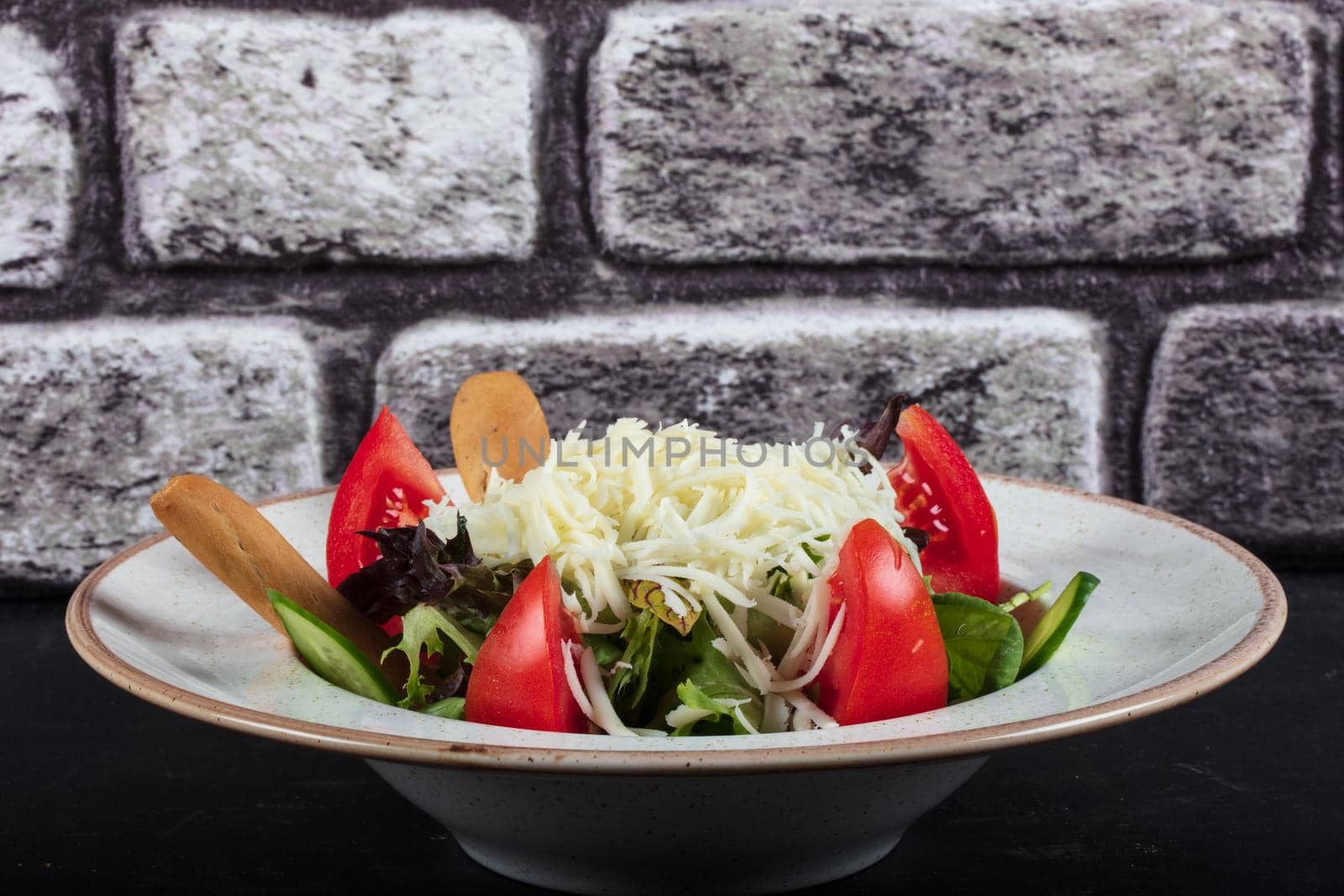 healthy eating, dieting, vegetarian kitchen and cooking concept - close up of vegetable salad bowl at home. High quality photo