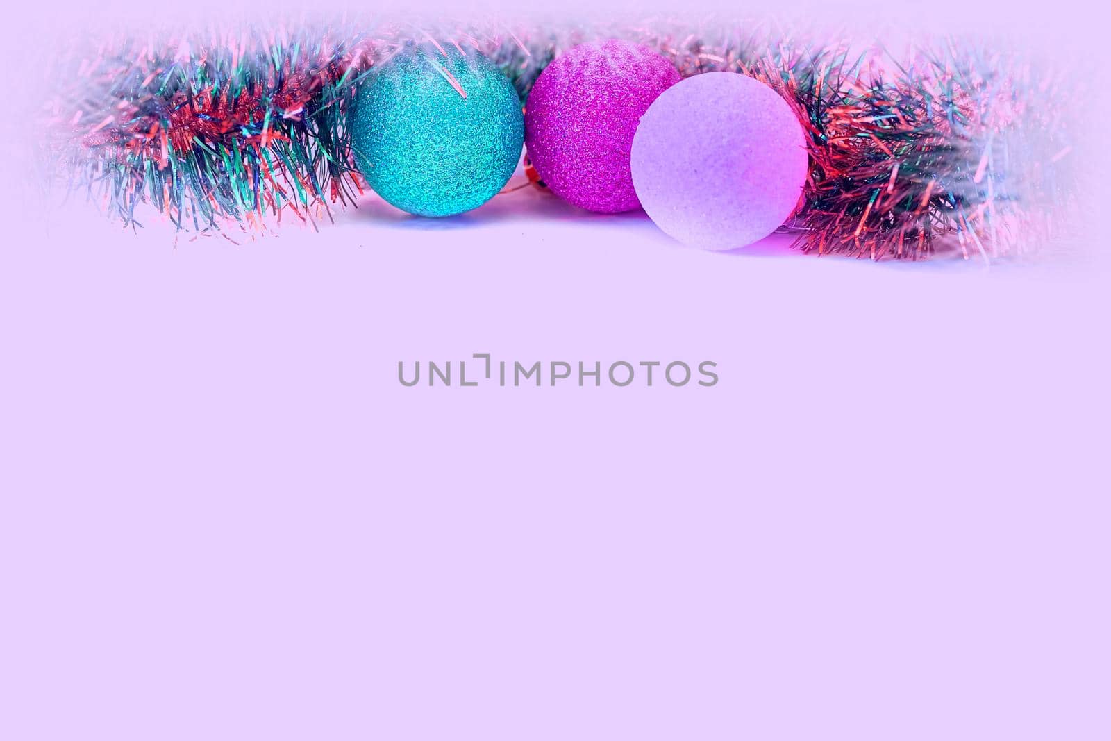 Christmas balls, Christmas tree rain covered with snow. Pink space for text by jovani68