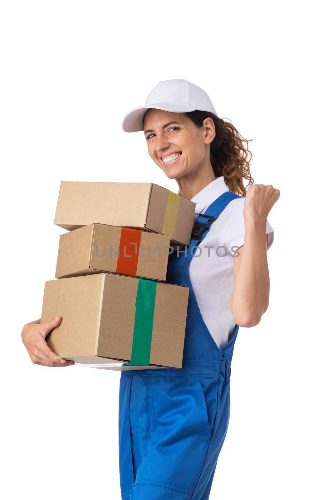 Portrait of delivery woman in white cap, t-shirt giving order boxes isolated on white background. Female courier step, cardboard box. Receiving package.