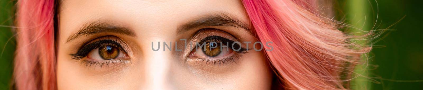 Macro shot of woman's eye with transparent makeup. Expressive look. sight