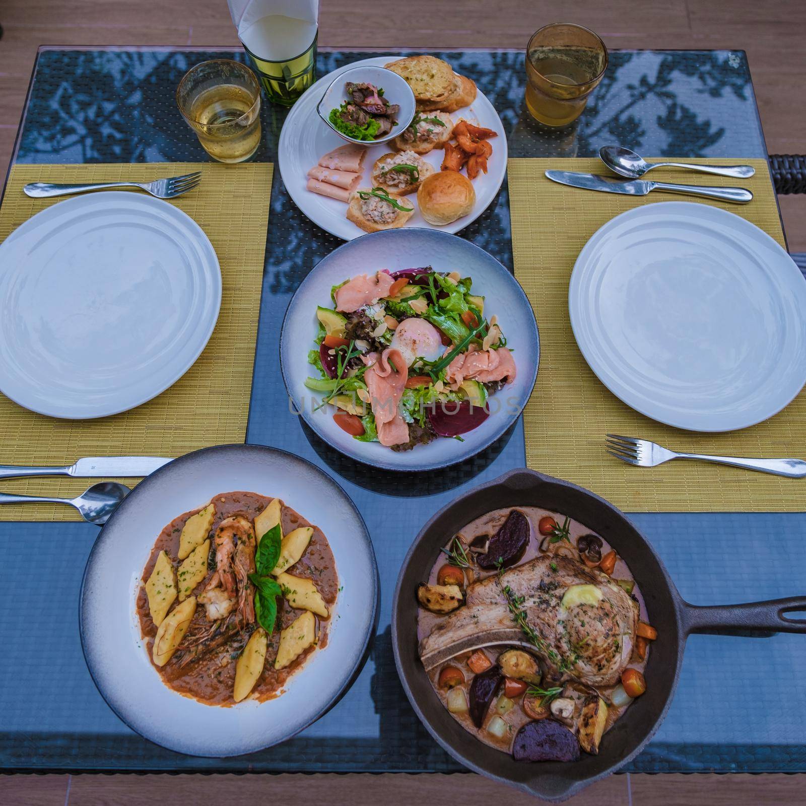 filled steak with cream , grilled lamb veal ribs loin on a plate with baked potatoes by fokkebok