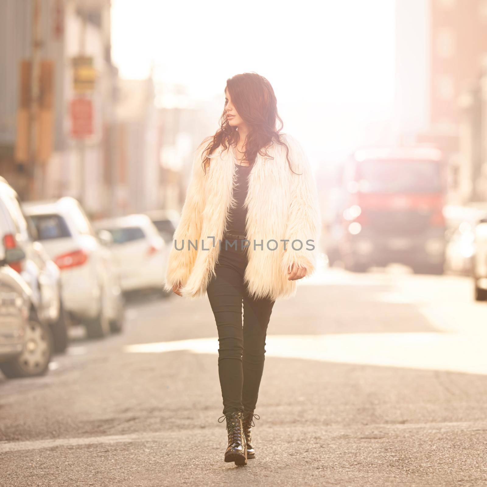 The road is her runway. an attractive young woman out and about in the city