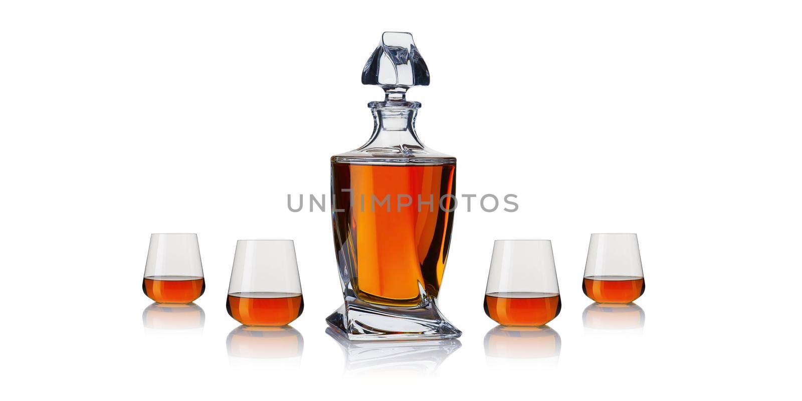 Decanter with cognac. Whiskey decanter on white background. Strong alcoholic drink in a decanter