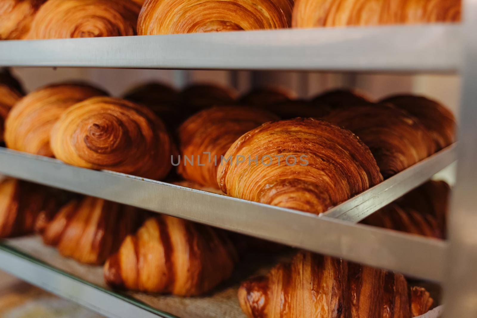 Bun production. Family bakery. Hot croissants only from the oven. Fresh bakery.