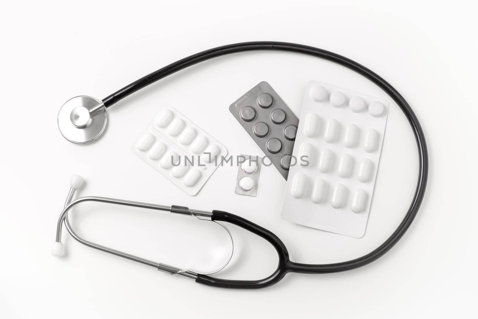 Medical equipment on white background. Stethoscope, pills, tablets. Medical tools. Medicine and healthcare