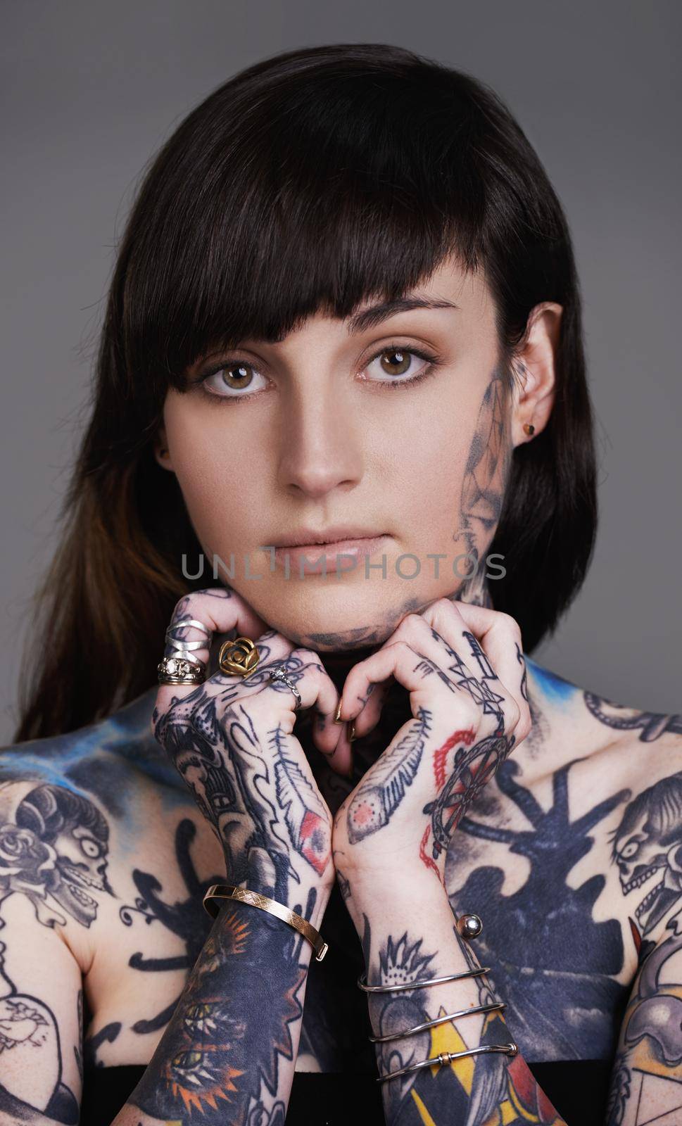 A walking art exhibition. A cropped shot of a tattooed young woman