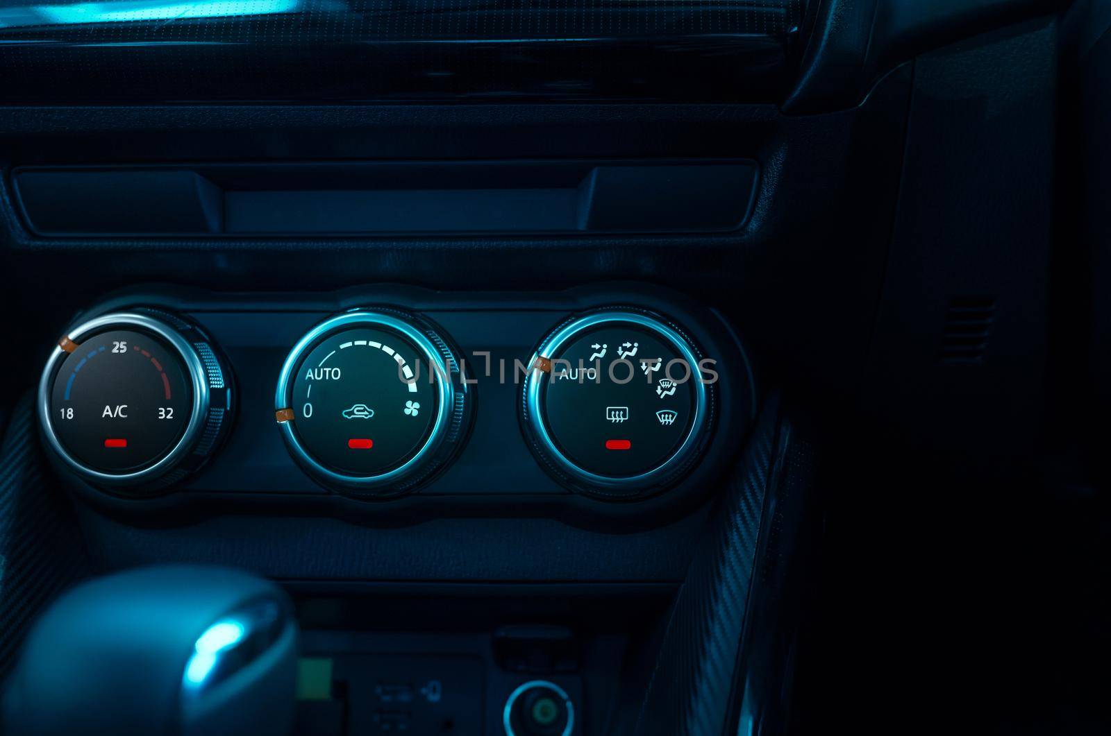 Climate control knob in modern car. Car air conditioner. Automobile air conditioning system. Car ventilation system. Ventilation system in vehicle. Round climate control adjusting knob. Car interior.