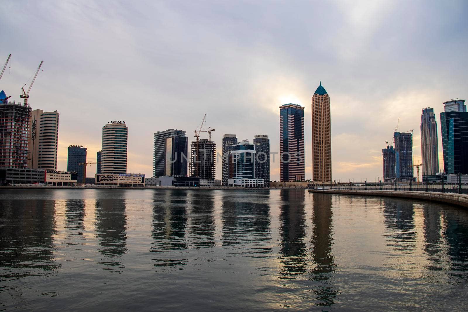 Modern buildings along the Dubai water canal, business bay district UAE. Outdoors