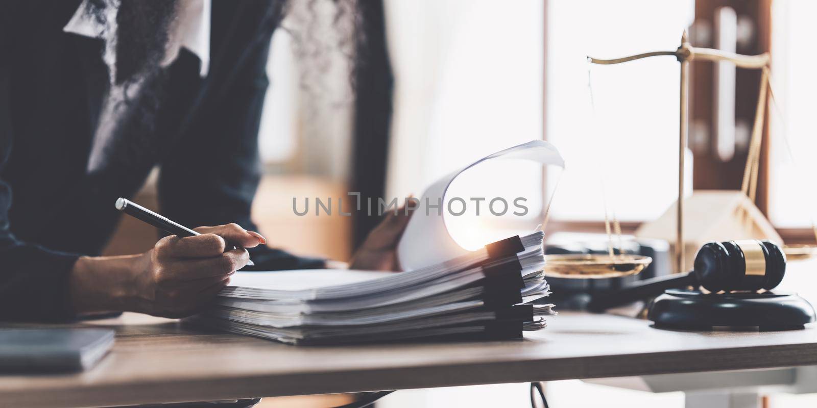 Lawyer business woman working or reading lawbook in office workplace for consultant lawyer concept.