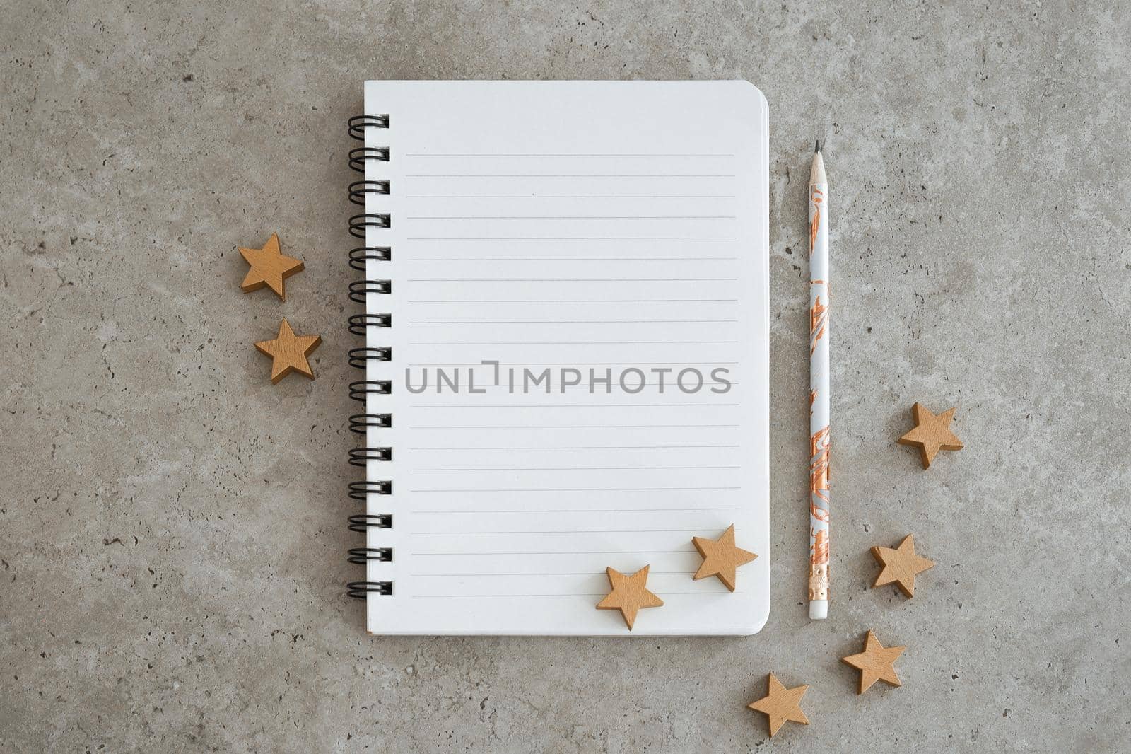 Top view of notebook with Christmas decorations. Goals, plans, dreams and to do list for new year. Free space, copy space, mockup or template for your text